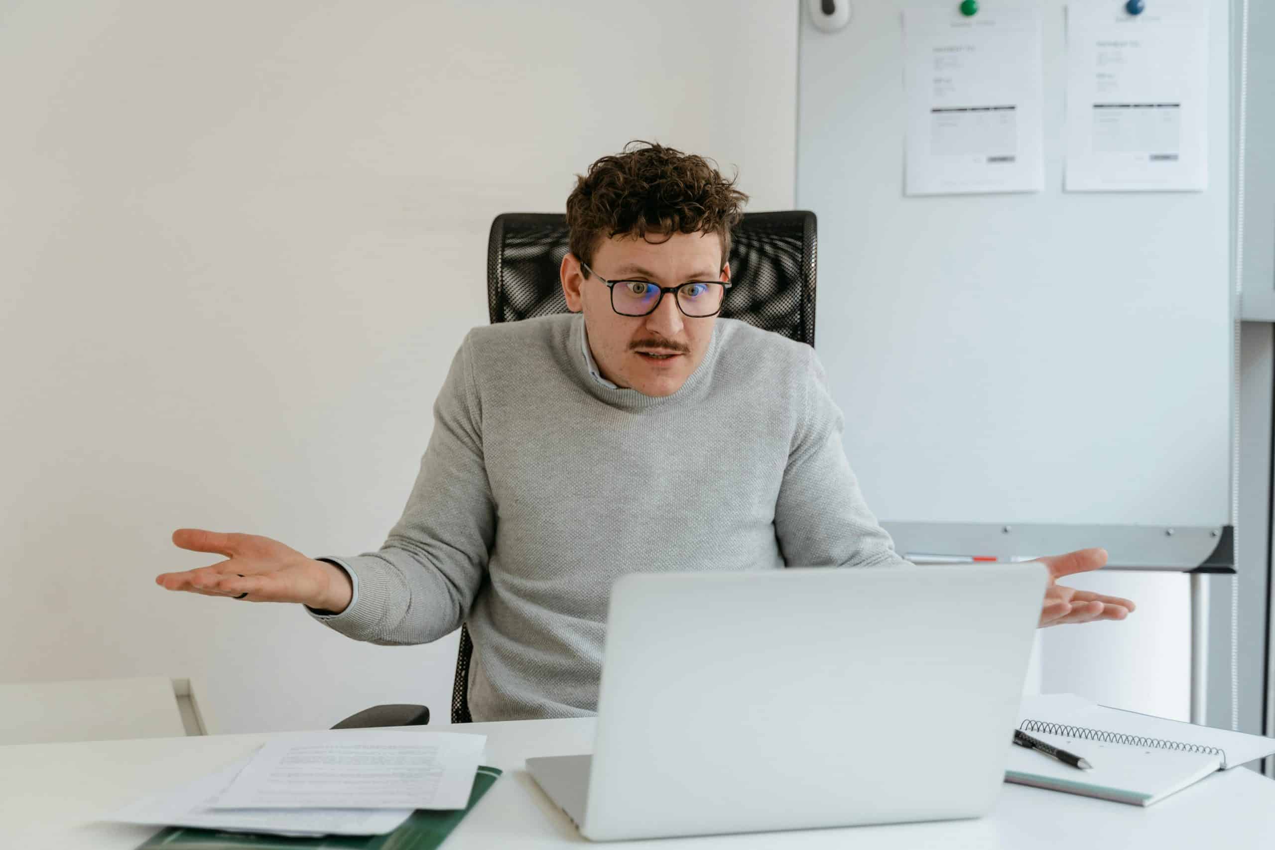 small business owner reviewing tiered pricing statement showing non-qualified downgrade fees