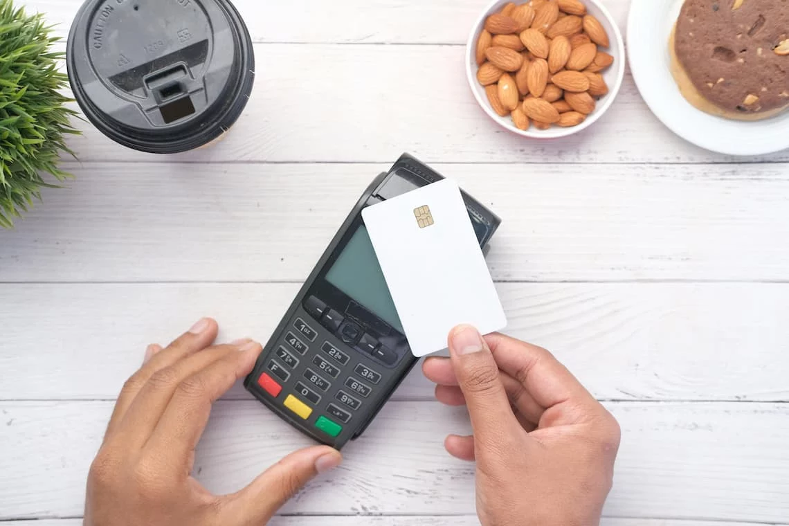 Merchant terminal showing an EMV fallback fee when a chip card is swiped instead of inserted