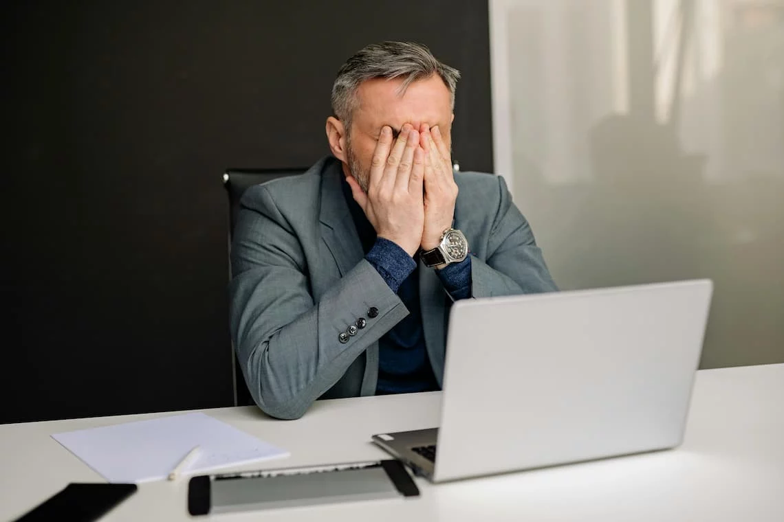 Small business owner reviewing a credit card processing statement at a counter, illustrating common Payment Depot complaints about pricing