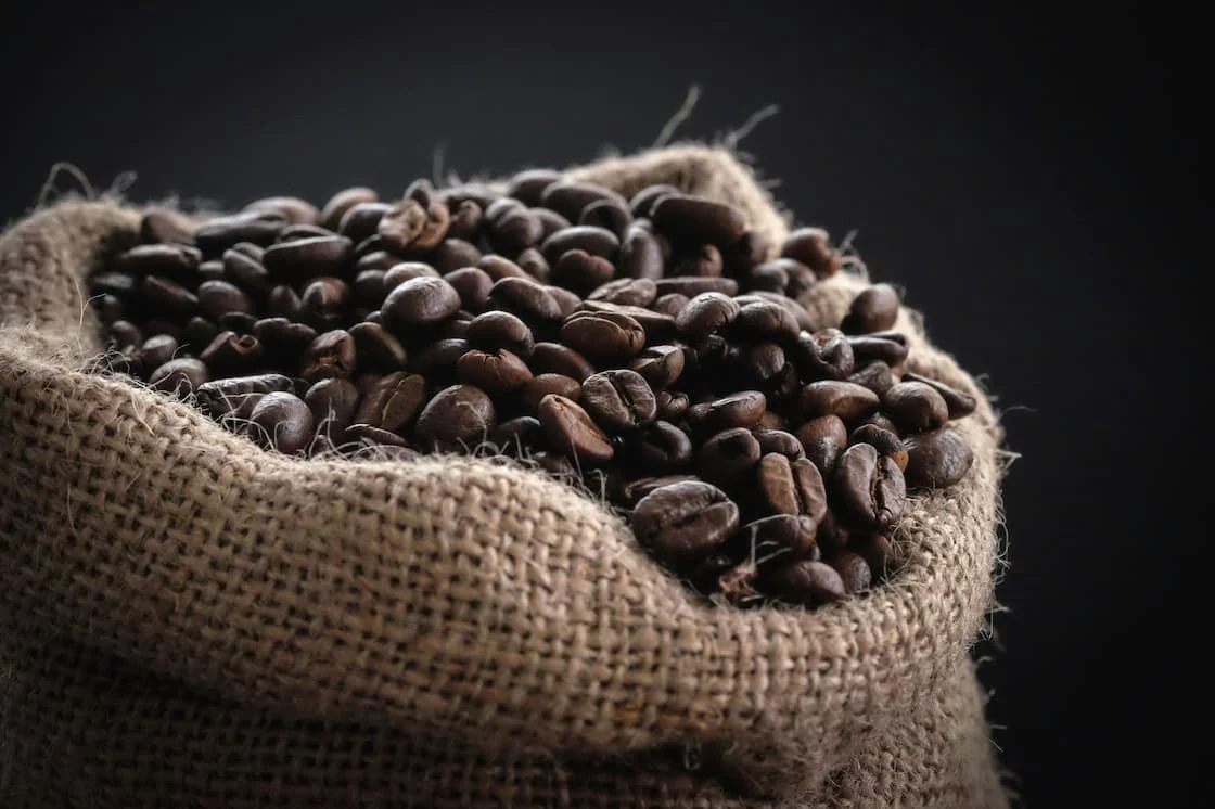 Bags of artisanal coffee boxed for shipping — the order volume behind online coffee payment processing