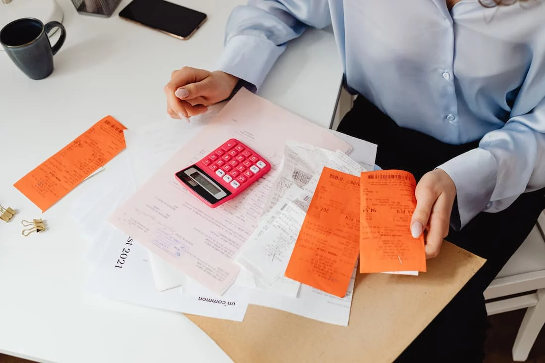 Swipe fee savings math on a small business counter with a card terminal and receipt